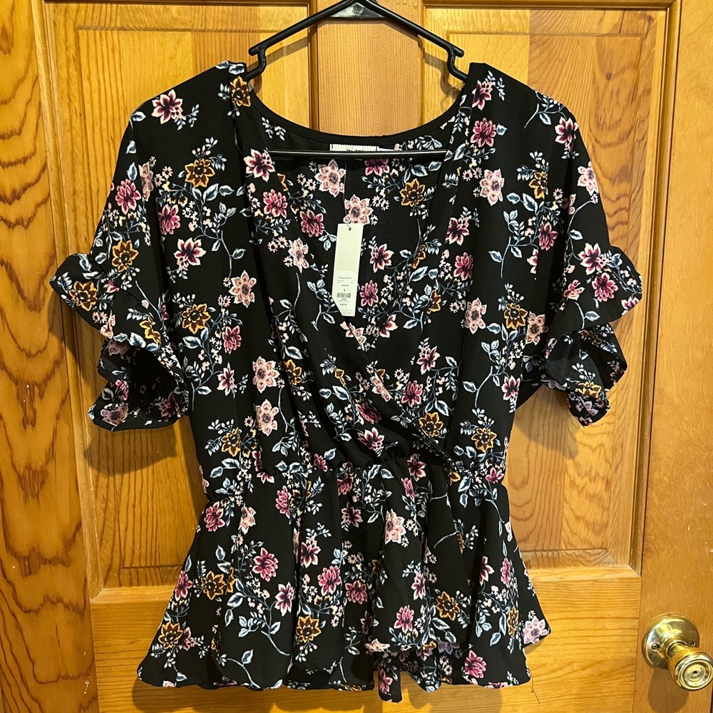 Floral blouse with tags still on. Size small